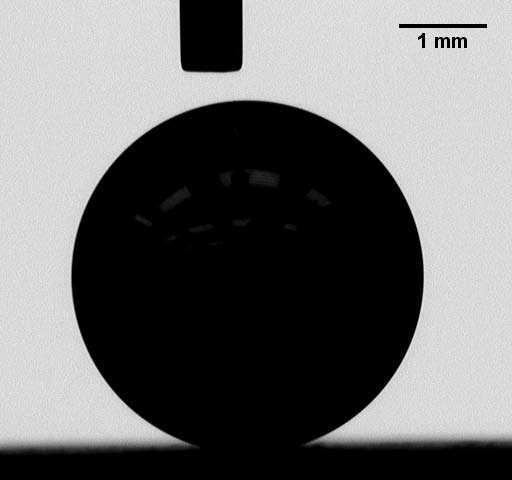 Figure 1.2: A steel ball of diameter D=4mm contacting a flat surface, imaged by Goniometer. The region is blurred near the contact surface. from point to point along the CL.