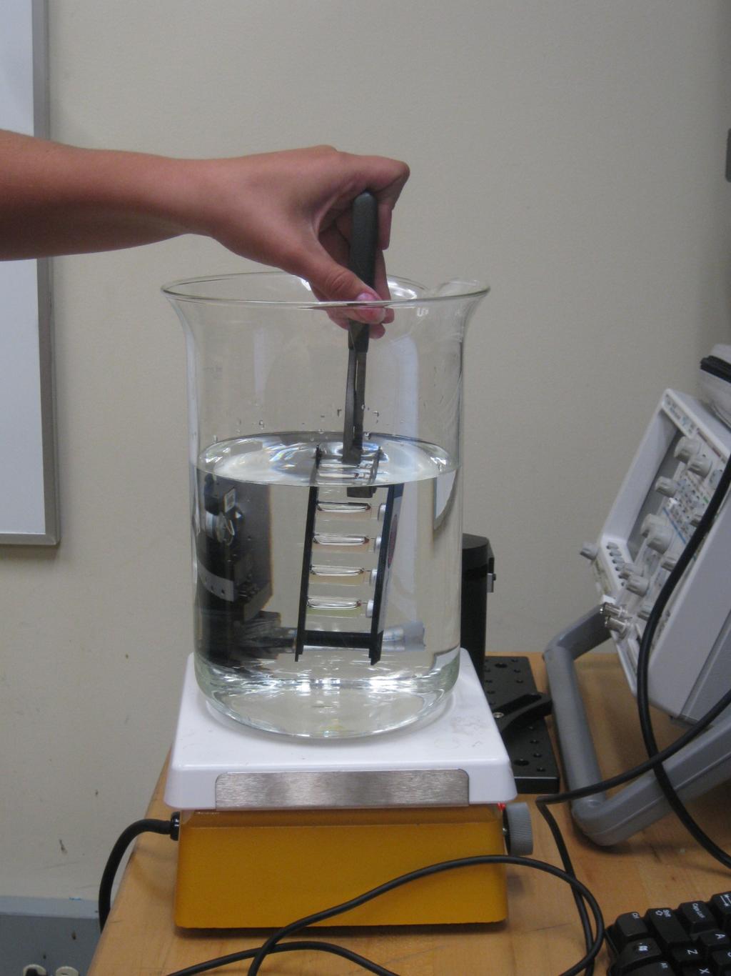 Fig. 5 Cenco Quantum Dots vial submerged in a large beaker full of hot water. Next the quantum dot vials were submerged in ice water and then allowed to slowly warm back up to room temperature.
