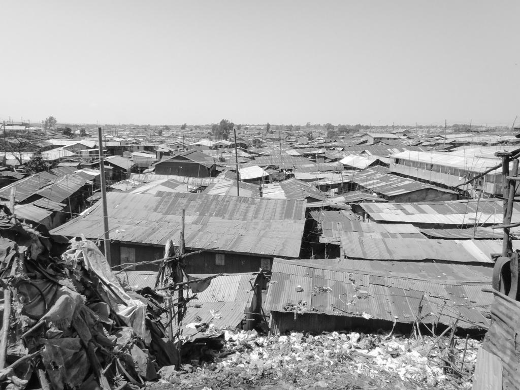 SECTION 2 HUMAN ENVIRONMENTS 15 marks Attempt ALL questions MARKS Question 4 Diagram Q4: Photograph of Kibera shanty town, Nairobi Look at