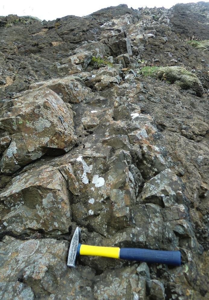 Tsokonombwe 870 Report 34 at several places along Litla Laxá river, fractures were observed in the Holocene overburden in the survey area, producing hot water of about 90 C. 3.5 Intrusive rocks Two types of intrusive rocks were observed in Mt.
