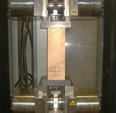 Assuming that the stiffness in axial direction features the same behaviour in tension and compression, in a first step a compressive load was applied only to the wooden cross-section of the specimens