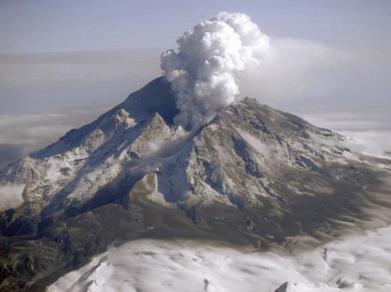 Section A The Challenge of Natural Hazards Question 1: Study Figure 1, a photograph showing a volcanic eruption in Alaska.