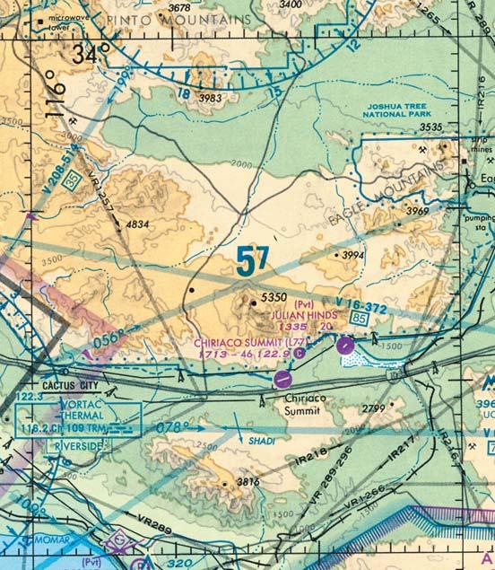 a quadrangle C. a magenta bordered area 18. [J6/2/2] What is the highest spot elevation shown in the sectional chart excerpt above?. 2,242 feet. B. 2,697 feet. C. 3,192 feet.