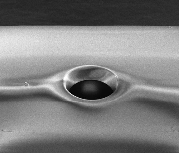 crystal fibre ( diameter 12 µm, depth ~68 µm), and b) Fibre