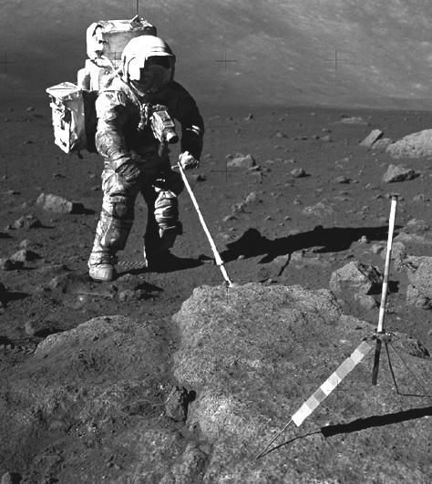 (h) 10 Astronauts use tongs to help pick up rocks. The tongs are made from metal strips.