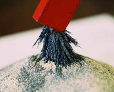A mixture of iron and sulfur particles A magnet attracts the