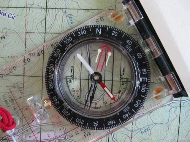 Bearings cont.. A properly aligned compass on a Map to determine Bearing.
