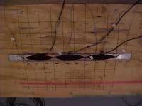 the baffled box did not contribute to the sound power radiated or interfere with the beam vibrations at a significant level. Figure 101. Fixed-Fixed Beam With the Test Grid Laid Out on the Box Top.