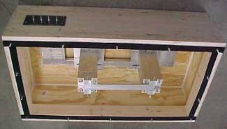 Figure 32. Plywood Box Constructed With the Simply Supported Beam Inside (Top Cover Removed). (a) (b) (c) (d) Figure 33. Baffled Box Covers Constructed From Plywood.