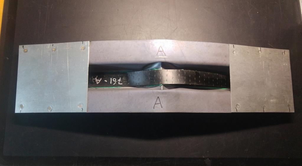 (a) (b) Figure 3.10: Photo of the hat profile beam after the experiment for both (a) test beam A and (b) test beam E.