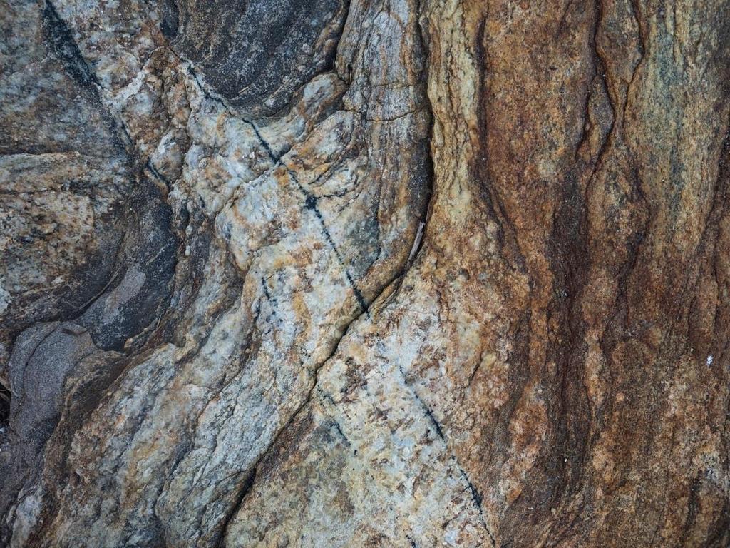 Photo by Ian Hillenbrand Cross Cutting Vein Two thin veins of granite stretch across the outcrop from northeast to southwest.