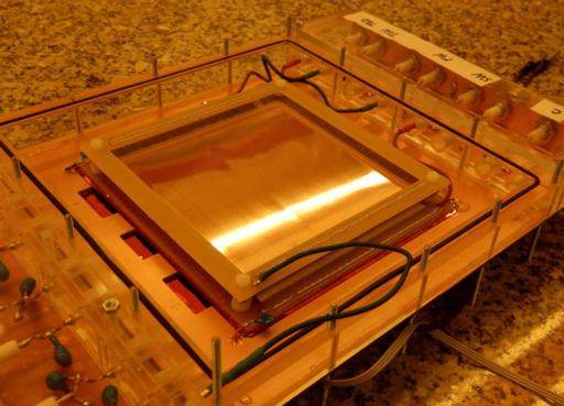 Figure 1. (Color online) Photograph of the chamber of the experimental setup. 1.0mm pulsed UV LED (defocused) quartz window 8.5mm cathode wire grid gold plated GEM Single electron source 8.