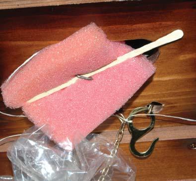 You might find one other item when unpacking your clock - a piece of sponge and a stick holding the pendulum hanger wire as shown in the photo.