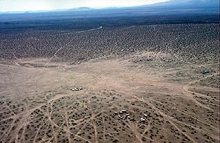 throughout the deserts of the southwest United States. Damage caused by offroad vehicles in the Mojave Desert, California. Trails in desert crust will remain visible for hundreds of years.