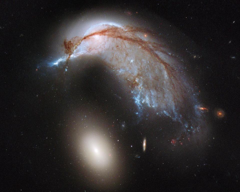 Enormous Elliptic Galaxy NGC 2937 & Porpoise Galaxy it disrupted (NGC 2936).