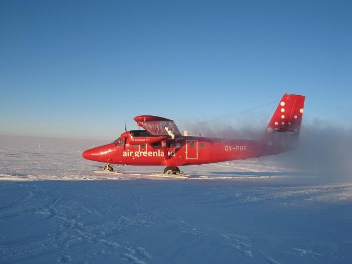 Planes with skis fly to Summit Station and land on a snow runway.
