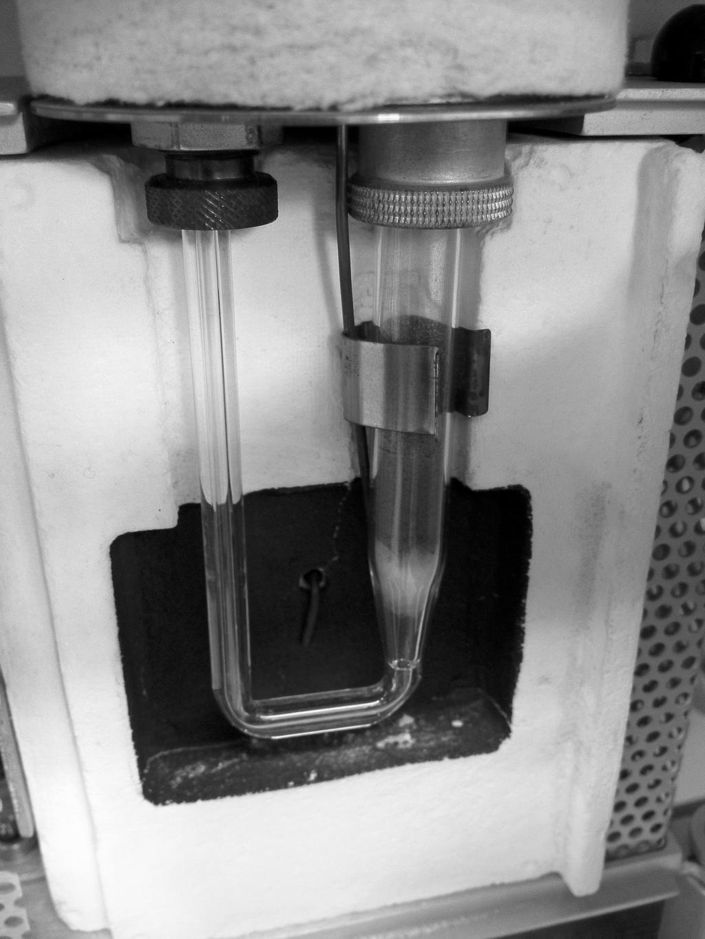 OpenStax-CNX module: m43579 5 Figure 2: A sample of Pd/Al2 O3 in a typical sample holder. Water molecules are removed from the gas stream using a cold trap.