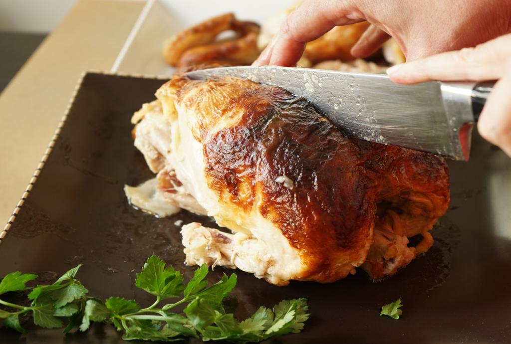 To remove the breast meat, start by running your knife right along the breast bone, making a long even slice.