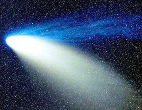edges Away from the warmer gas and towards the cooler gas Comet Tails Comet Hale-Bopp - 1997 Comet nears Sun vaporizes ice on surface Releases dust and charged particles Solar