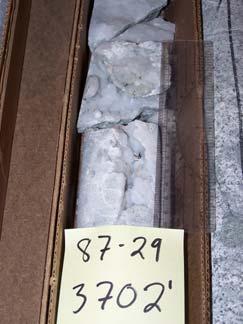 Massive calcite occurs as fracture infilling and as veins in Steamboat Springs Well 87-29 as seen in Figure 9. Stibnite (antimony sulfide) also occurs as an infilling mineral (Jones 1912).