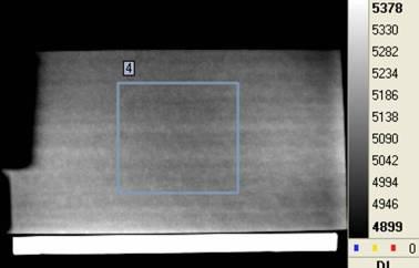 a) b) Figure 7: a) Thermographic image of a reference specimen - The blue square delineates the area chosen for a statistical analysis and b) Influence of overheating temperature on corrected digital