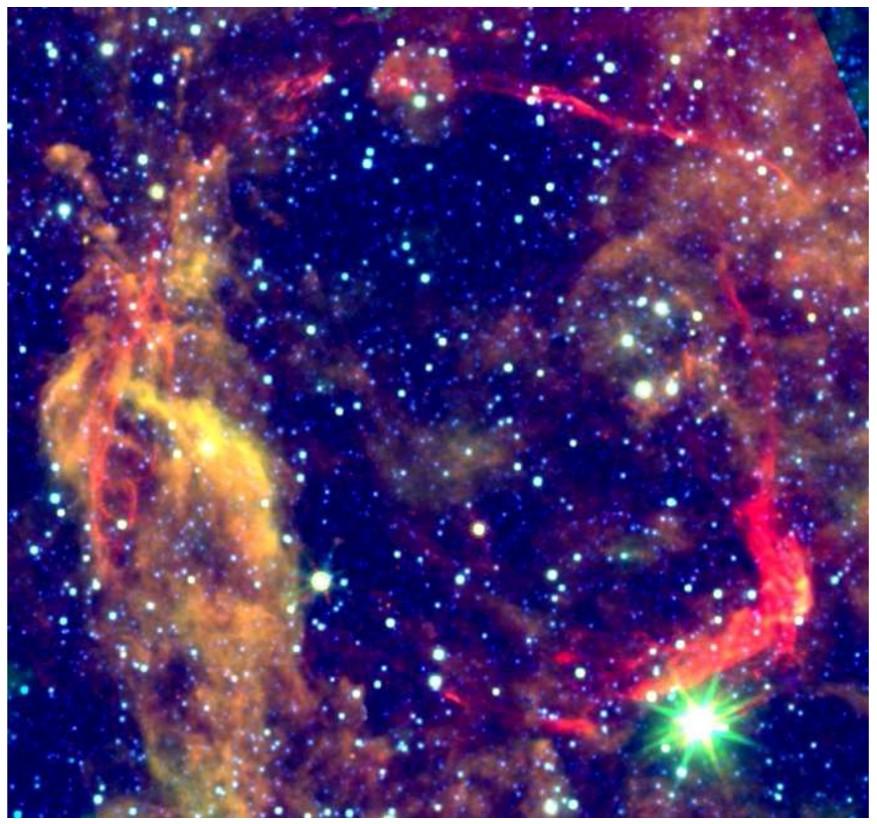 The colors of this image, which reflect the temperature of the dust, separate the emission that is associated with the SNR from that of the background.