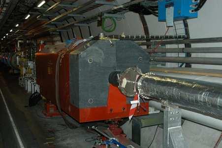 Figure 1.3: Photo of the TAN absorber located 140 m from the IP. Left: TAN fully assembled in the LHC tunnel seen from the IP side. Right: TAN during assembly at CERN seen from the top facing the IP.