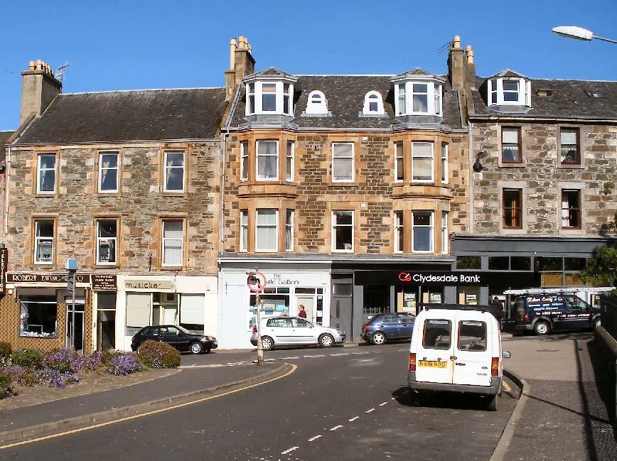 Fig. 8. Typical early to mid 19 th century buildings in Rothesay, constructed using local dark igneous rubble (greenstone) with pale sandstone dressings.