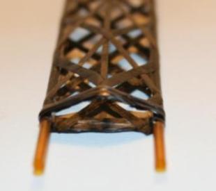 T [ºC] ITS Upgrade CDR 153 Pipe CF paper Carbon Fiber Glue Silicon Glue Kapton heater Figure 5.21: Picture of the wound truss structure with pipes (right) and schema of the section view (left).
