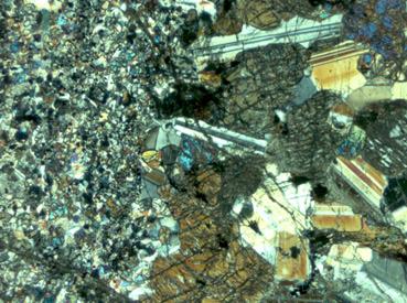 g) h) 2. 2. Fig. 5.3: Recrystallized norite: (g) Subrounded orthopyroxene intergrown with ioclase and in places enclosed in ioclase, sample MO 17.