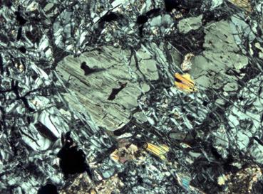 2 Main Zone In the two boreholes examined, the Main Zone consists of medium grained gabbronorite characterised by ioclase, orthopyroxene, inverted pigeonite and augite.