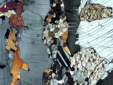 Recrystallized orthopyroxene () and minor
