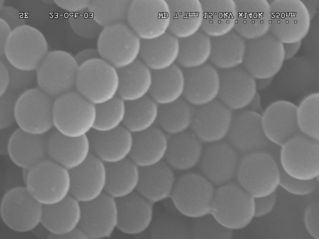 b) High magnification SEM image of the nanospheres formed by compound 2 clearly