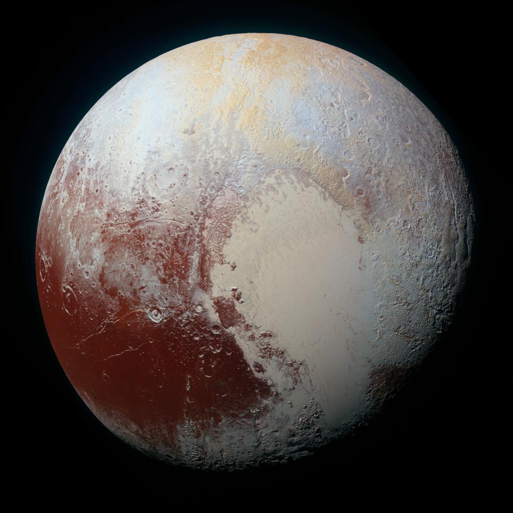 Obr. 9. Pluto vo falos ny ch farba ch na zistenie rozdielov v zloz enı a s truktu re povrchu. U tvar pripomı naju ci srdce dostal na znak vd aky meno po objavitel ovi Pluta Tombaugh Regio.