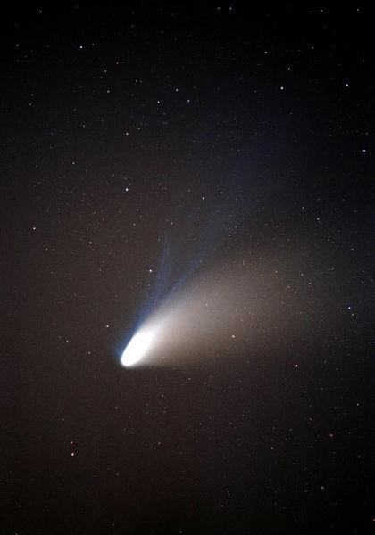 sunlight and solar wind -> comet ejects ionized gases and dust -> tail McNaught, 2007