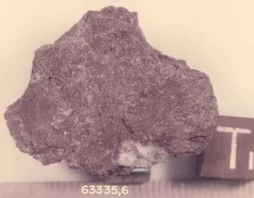 63335 Impact Melt Breccia 65.4 grams,1,2,3,4,9,10,8 Figure 2: 63335,6. Cube is 1 cm. S75-33389.,7 Introduction 63335 is a sample chipped off of Shadow Rock (Ulrich 1973).