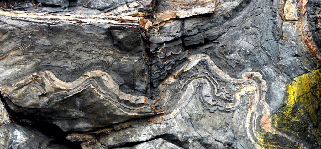 Figure 6.9 Limestone, a sedimentary rock formed in marine waters, has been altered by metamorphism into this marble visible on Quadra Island, BC. Source: Steven Earle (2015) CC BY 4.