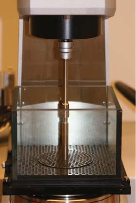(c) Picture of the actual setup, with 1: rheometer; 2: disk; 3: glass box.