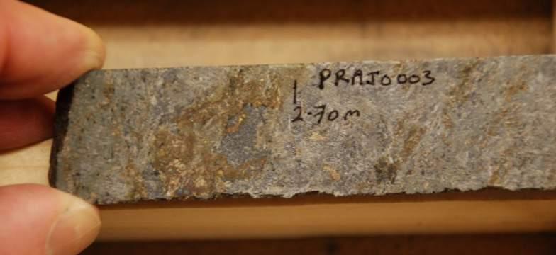 Garnet-grunerite schist mineralized with pyrrhotite and arsenopyrite.