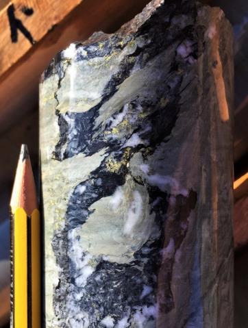 the license. Photos of core with orogenic copper mineralisation in the upper part of borehole ALFP 003 A) Blebs of chalcopyrite associated with quartz veining in black shale 745.