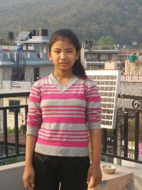 Pokhara Village: Student Spotlight MABINA BARAM M a e is Ma i a a d I o e f o a s all illage i the Go kha dist i t i e t al Nepal.