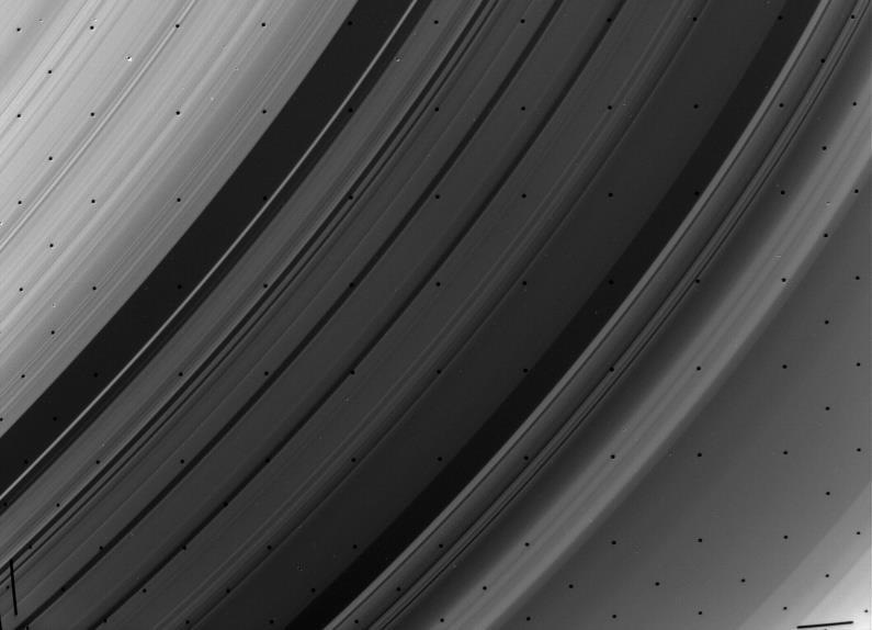 Every 2 orbits, iceballs in the Cassini Division get tugged towards Mimas, clearing a gap.