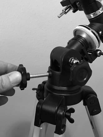 Washer Azimuth lock knob Figure 7. a) Install the equatorial mount onto the tripod mount platform, then b) secure it from the underside with azimuth lock knob.