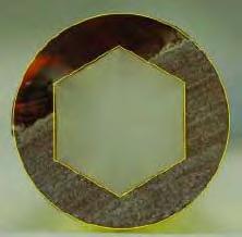 The hexagonal and circular shapes of the die exits are preserved well in the extruded glass elements.