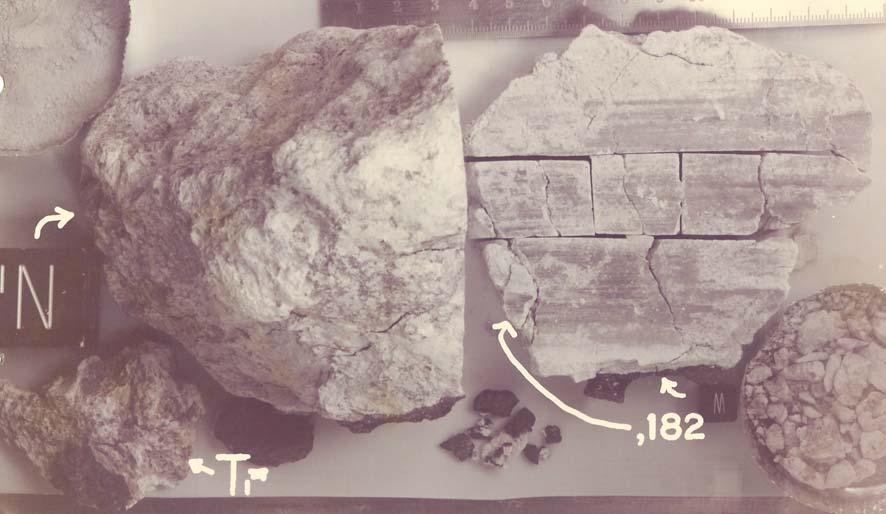 ,172,54,175,171,169 Figure 12: Processing photo of second slab. Big cube is 1 inch. S74-28115. Note the saw marks.