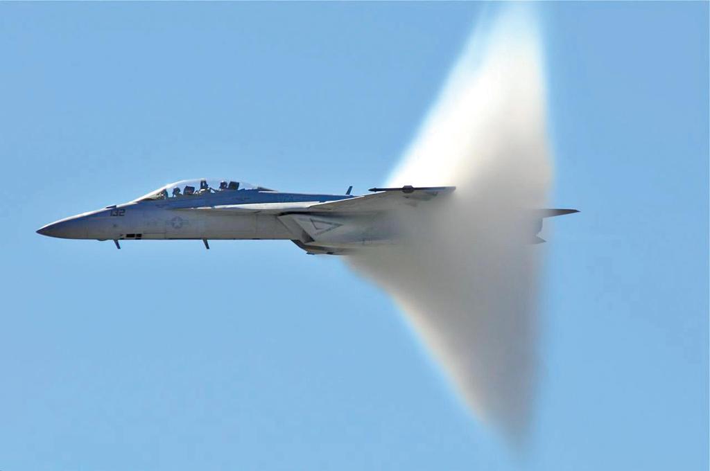 Mach Cone A apor cone is formed as this F/A-18F Super Hornet closes on Mach 1.(Hayman Tam) http://inflight.
