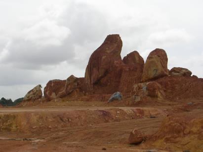 Basalt: Exposed corestones due to excavation Basic/mafic igneous rock fine-grained (holohyaline), extrusive (volcanic).