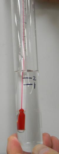 A B C Figure 2. Lift the thermometer and mark the KNO3 solution level (step 4 and 5). 5. Mark the solution level on the test tube with a sharpie and label it as 1 (Figure 2C).