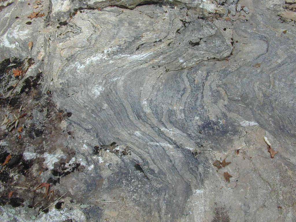 Foliated Rocks: Gneiss Gneiss is a medium- to coarse-grained rock formed under high grade-metamorphic conditions.