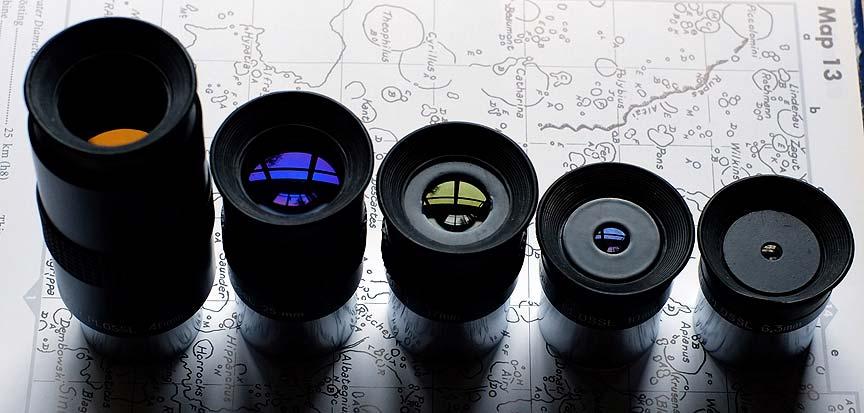 Lens coatings give a distinctive purple-blue/violet, or amber/yellow colors to light reflected off the surface. Graphics appear to be silk-screened on the surface of the housing.